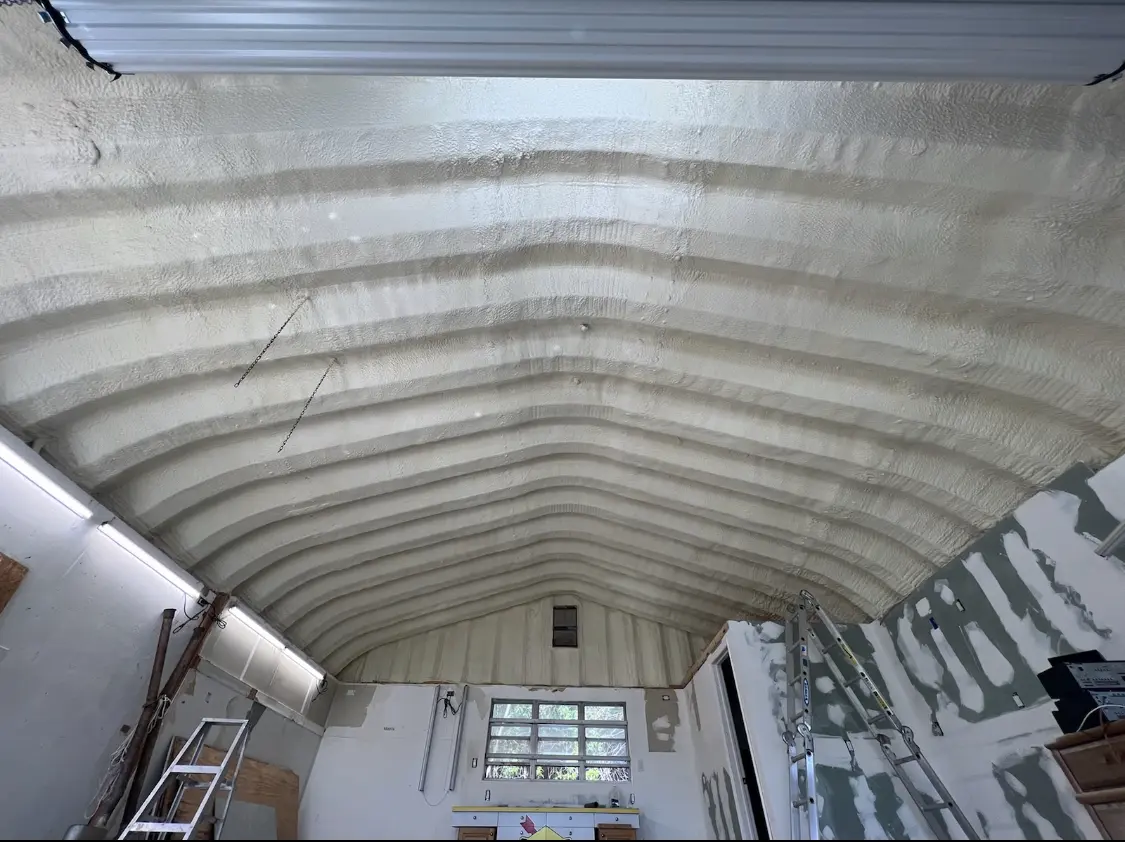 Spray polyurethane foam applied to the underside of a metal roof deck in Peachtree Corners